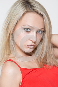 Young smiling woman in red dress. Isolated over white background.