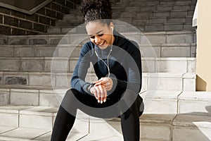 Young smiling woman in sports clothes