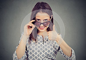 Woman in sunglasses approving something photo