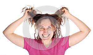 Young smiling woman tearing her hair