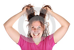 Young smiling woman tearing her hair