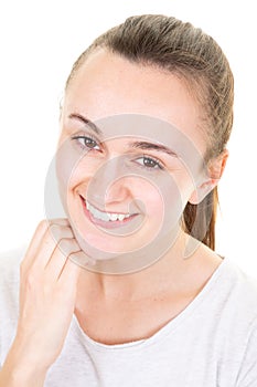 Young smiling woman touching her face isolated on white background