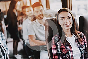 Young Smiling Woman Traveling on Tourist Bus