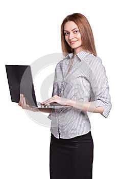 Young smiling woman working on laptop isolated