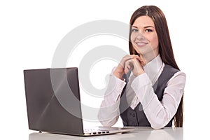 Young smiling woman working on laptop isolated