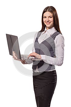 Young smiling woman working on laptop isolated