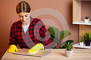 Young Smiling Woman in Yellow Gloves Cleaning House