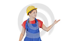 Young smiling worker woman talking and showing objects to her si