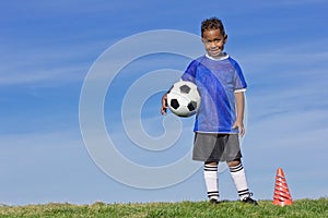 Young Soccer Player holding a ball