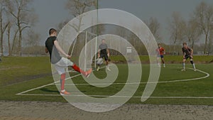 Young soccer player performing corner kick