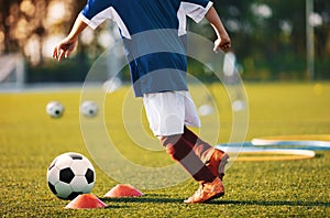 Young Soccer Player Training with Ball