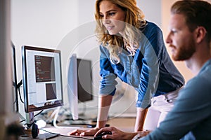Software engineers working on project and programming in company