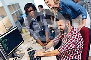 Software engineers working on project and programming in company