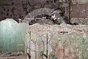 Young soldier behind obstacle