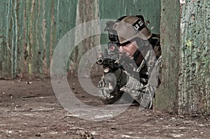 Young soldier behind obstacle