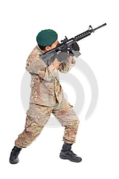 Young soldier or sniper aiming with a rifle
