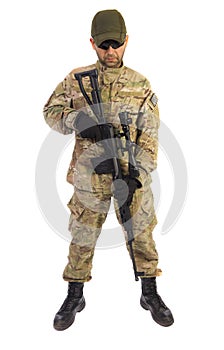 Young soldier standing with a sniper riffle