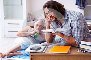 Young son student and dad alcoholic