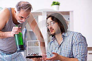 Young son student and dad alcoholic