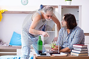 Young son student and dad alcoholic