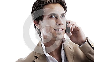 Young sophisticated businessman on the phone