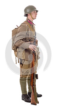 Young Soviet soldier with rifle on the white background