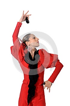 Young Spanish woman dancing flamenco with castanets in her hands