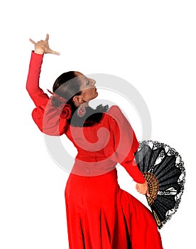 Young spanish woman dancing flamenco in typical folk red dress
