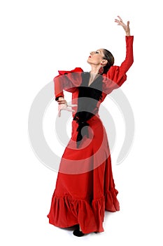 Young spanish woman dancing flamenco in typical folk red dress