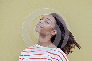 Young spiritual african american woman 20s wearing casual white tank top