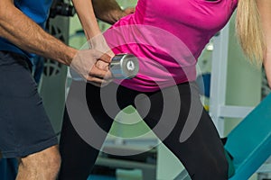 Young sport couple in the gym