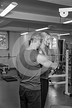 Young sport couple in the gym