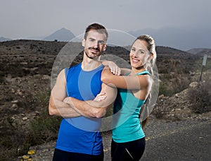Young sport couple posing together cool and smiling happy girl leaning on man shoulder