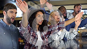 Young sport fans cheering national team victory, supporters clapping hands