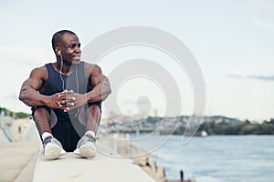 Young Sport man resting after workout exercise.