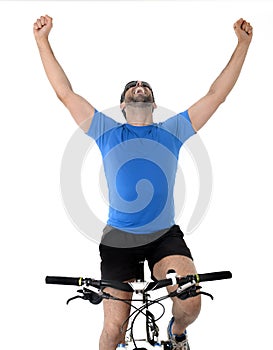 Young sport man riding mountain bike celebrating race victory