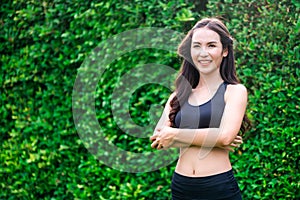 Young sport woman doing morning exercise in park.