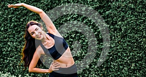 Young sport woman doing morning exercise in park.