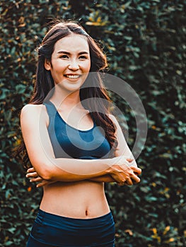 Young sport woman doing morning exercise in park.