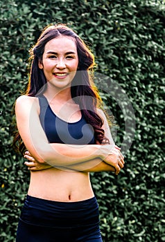 Young sport woman doing morning exercise in park.