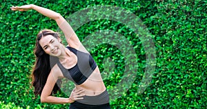 Young sport woman doing morning exercise in park.