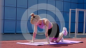 Young sport woman engaged gymnastics or stretching use resistance band.