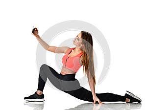 Young sport woman gymnastics doing stretching fitness exercise workout isolated on a white