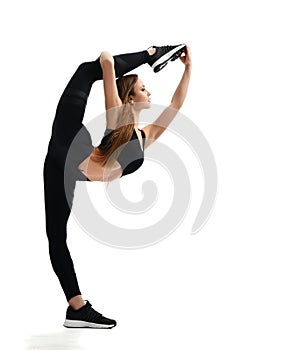 Young sport woman gymnastics doing stretching split fitness exercise workout isolated on a white