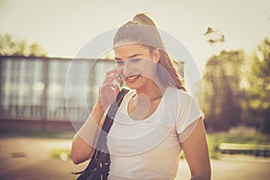 Young sport woman talking phone.