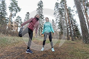 Young sportive couple does stretching exercises