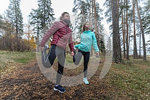 Young sportive couple does stretching exercises