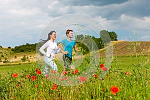 Young sportive couple is jogging outside