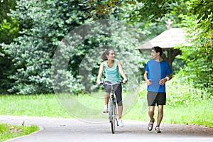 Young sportive couple jogging at the park