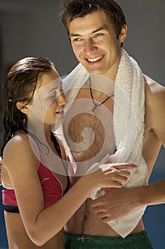 Young sportive couple relax at swimming pool